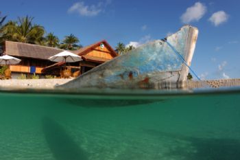 Dug out canoe in front of Wakatobi resort. Taken with Nik... by David Stephens 